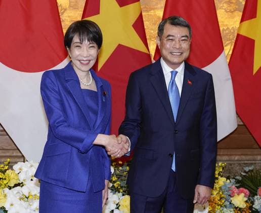 Japan-Vietnam talks Japanese Prime Minister Sanae Takaichi (L) and her Vietnamese counterpart Le Minh Hung shake hands ahead of their talks in Hanoi on May 2, 2026.  A14AA0005510698P