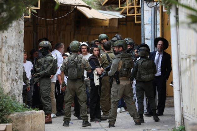 Israeli settlers raid Hebron under heavy military protection HEBRON, WEST BANK, PALESTINE - MAY 02: Israeli settlers, escorted by heavily armed Israeli security forces, enter the Old City of Hebron in the West Bank, Palestine on May 02, 2026. During the incursion, Israeli soldiers implemented strict security measures, setting up temporary checkpoints and restricting the movement of Palestinian residents to facilitate the settlers passage through the historic district. Wisam Hashlamoun Anadolu Hebron West Bank. Editorial use only. Please get in touch for any other usage.  Copyright: x2026xAnadoluxWisamxHashlamounx
