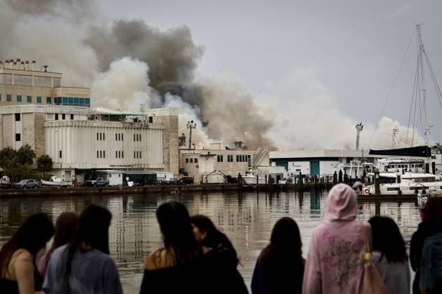 May 2, 2026, St. Petersburg, Florida, USA: Onlookers watch as fire personal work to extinguish a two-alarm fire at the University of South Florida campus Saturday, May 2, 2026 in St. Petersburg. St. Petersburg USA - ZUMAs70_ 20260502_zan_s70_003 Copyright: xLuisxSantanax