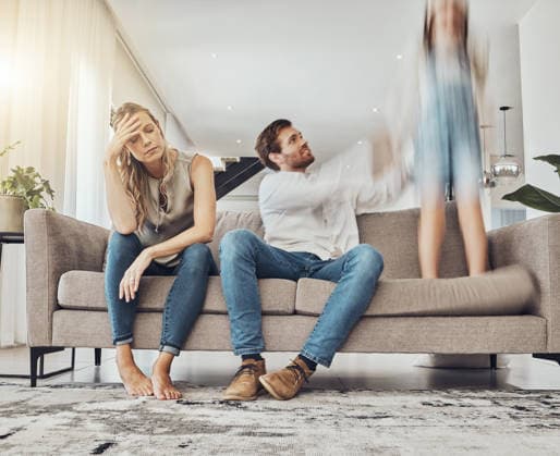 Family life stress, parents and child, chaos at home and energy, motion blur and burnout headache. Kid jump on couch, woman has migraine and man calming girl, hyperactive with ADHD and mental health. (License=RF) ,model released, Symbolfoto  Copyright: xZoonar.com YurixArcursxpeopleimages.comx 19824752 ,model released, Symbolfoto ,property released