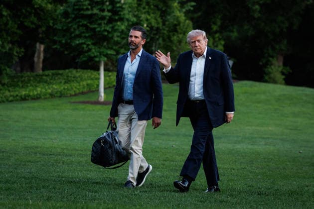 DC: President Trump Returns to the White House President Donald Trump walks across the South Lawn towards the White House with his son, Donald Trump Jr., after landing in Marine One on May 30, 2026 in Washington, D.C. President Trump is returning to the White House after spending the weekend at his private club, Mar-a-Lago, in Florida. (Photo by Samuel Corum Pool ABACAPRESS.COM) Washington DC United States  Copyright: xPool ABACAx