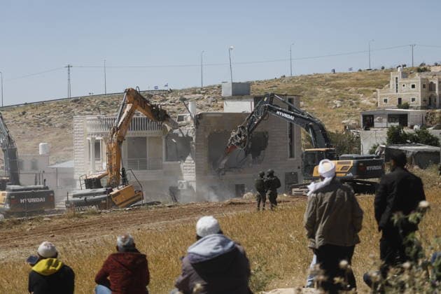 Israeli forces demolish Palestinian home in Hebron-area village Israeli army forces, accompanied by bulldozers, demolish a Palestinian home in the village of al-Deirat, east of Yatta, south of Hebron in the West Bank, on May 4, 2026. The demolition left a family, including children, displaced, as the operation was carried out under military presence that prevented residents from approaching, amid ongoing demolitions in various areas across the West Bank. Photo by Mamoun Wazwaz apaimages Hebron West Bank Palestinian Territory 040526_Hebron_MW_00(4) Copyright: xapaimagesxMamounxWazwazx xapaimagesx