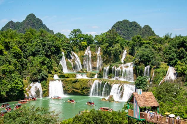 (260504) -- BEIJING, May 4, 2026 -- Tourists visit the Detian Waterfalls scenic area in Daxin County of Chongzuo City, south China s Guangxi Zhuang Autonomous Region, May 4, 2026. People across China stepped out to fully enjoy their leisure time during the ongoing May Day holiday. (Photo by Xinhua) CHINA-MAY DAY HOLIDAY-TOURISM (CN) ZhaoxJingwu 