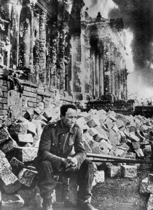 RECORD DATE NOT STATED A photograph of a German soldier amidst the ruins of the Reichstag building in Berlin. A photograph of an unidentified German soldier sitting amidst the substantial rubble of the severely damaged Reichstag building in Berlin shortly after the Russian army entered the city, marking the final stages of the Second World War on the European Eastern Front and the defeat of the Third Reich. 1945. Editorial use only. All other uses to be cleared with the copyright owner (World History Archive), in advance., WHA_011_0149.jpg, World War II; Second World War; WWII; 1945; Berlin; Reichstag building; Battle of Berlin; Eastern Front; German soldier; Wehrmacht; Soviet Army; Red Army; Third Reich; Nazi Germany; German defeat; Fall o Copyright: xx