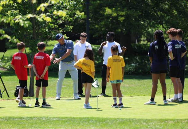Golfer Bryson DeChambeau gathers with children on the putting green on the South Lawn of the White House after President Donald Trump signed a proclamation inside the Oval Office at the White House in Washington, DC on Tuesday, May 5, 2026. The memorandum is set to restore the Presidential Fitness Test Award, a competitive school-based fitness program last seen under the Obama administration.  WASP20260505102 TomxBrenner