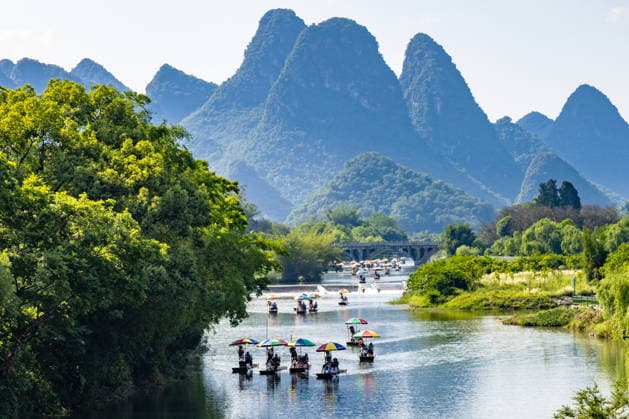 Bamboo Rafting in Yangshuo Tourists are drifting on bamboo rafts at Yulong Village section of Yulong River Scenic Area in Yangshuo County, Guilin City, Guangxi Province, China on May 5, 2026. Guilin Guangxi China  Copyright: xCFOTOx i1778070380412
