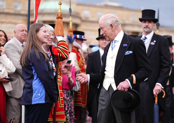 Royal Garden Party at Buckingham Palace King Charles III talks to Amy Solomons from GirlGuiding during a Royal Garden Party at Buckingham Palace, London. Picture date: Wednesday May 6, 2026., Credit:Aaron Chown Avalon UK, London  Copyright: xAaronxChownx xAvalonx 1096939470