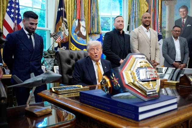 President Donald Trump, flanked by group of UFC fighters, speaks in the Oval Office of the White House in Washington, DC on Wednesday, May 6, 2026.  WASP20260506129 YurixGripas