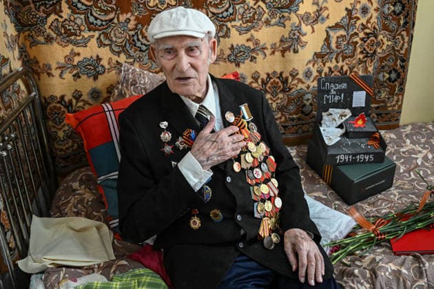 Russia WWII Veterans 9159126 07.05.2026 World War II veteran Ivan Olenin, 101, receives congratulations ahead of Victory Day, marking the 81st anniversary of the victory over Nazi Germany in World War Two, in Lugansk, Lugansk People s Republic, Russia. Ivan Fyodorovich was conscripted into the Red Army in October 1943. He served as a squad commander in the 112th Separate Reconnaissance Artillery Battalion. Olenin took part in the liberation of Poland and the assault on Berlin. He was awarded the Order of the Patriotic War, 2nd Class, and the Order of the Red Star, as well as the medals For Combat Merit, For the Liberation of Warsaw, For the Capture of Berlin, and For the Victory over Germany in the Great Patriotic War 1941 1945. Sergey Bo  Copyright: xSergeyxBobylevx