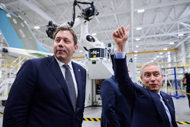 May 8, 2026, Toronto, On, Canada: German Vice-Chancellor and Federal Minister of Finance Lars Klingbeil, left, and Minister of Finance and National Revenue Francois-Philippe Champagne wave to workers during a tour of Bombardier s aircraft assembly centre in Mississauga, Ont., on Friday, May 8, 2026. Toronto Canada  - ZUMAc35_ 20260508_zaf_c35_043 Copyright: xSammyxKoganx