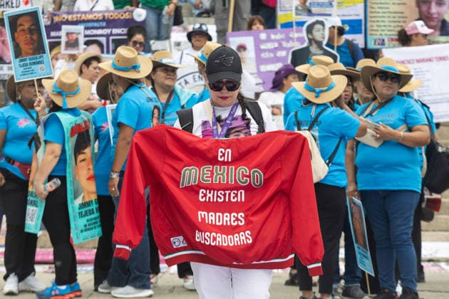 May 10, 2026, Mexico City, Mexico: On Mothers Day, collectives of searching mothers and relatives of missing persons took part in the XIV National Dignity March: Mothers Searching for their Sons, Daughters, Truth and Justice, in Mexico City. The march moved from the Monument to the Mother to the Angel of Independence, where participants demanded answers for missing persons while also protesting against the staging of the 2026 FIFA World Cup amid the countrys disappearance crisis. Mexico City Mexico - ZUMAl178 20260510_znp_l178_057 Copyright: xCristianxLeyvax
