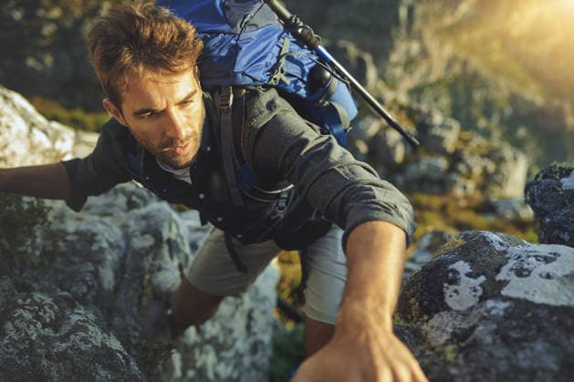 Mountains were made to get over. a young man hiking up a mountain (License=RF) ,model released, Symbolfoto  Copyright: xZoonar.com KasperxRavlox 20379592 ,model released, Symbolfoto ,property released