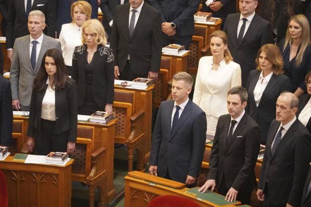 Magyar sworn in as Hungary s prime minister Tisza party leader Peter Magyar (3rd from R, front row) stands in the Hungarian parliament in Budapest on May 9, 2026. He was sworn in as the country s new prime minister the same day.  A14AA0005540710P