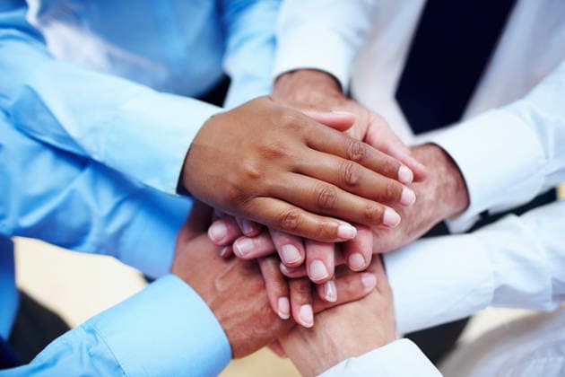 Business people, hands together and teamwork for motivation, unity or collaboration at office. Group of employees piling for building, diversity or meeting in trust, community or support at workplace. (License=RF) ,model released, Symbolfoto  Copyright: xZoonar.com KasperxRavlox 21177202 ,model released, Symbolfoto ,property released