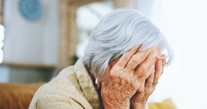 Senior woman, mistake and depression with headache, stress or anixety on living room sofa at home. Closeup of elderly, sad female person or hands on face in fear for alzheimers, dementia or fatigue. (License=RF) ,model released, Symbolfoto  Copyright: xZoonar.com YurixArcursxpeopleimages.comx 21794351 ,model released, Symbolfoto ,property released