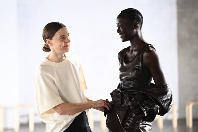 AUSTRALIAN FASHION WEEK, Australian designer Bianca Spender (left) fits a garment to a model backstage ahead of her runway show during Australian Fashion Week in Sydney, Tuesday, May 12, 2026. ( NO ARCHIVING SYDNEY NEW SOUTH WALES AUSTRALIA  Copyright: xDANxHIMBRECHTSx 20260512177796238299
