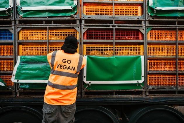 East London Chicken Save Animal rights activists with East London Chicken Save hold a vigil outside Kedassia Poultry in East London, bearing witness to chickens being transported to slaughter. Vigils organised by the group aim to document conditions and offer brief moments of compassion to animals inside transport trucks before they enter the facility., Credit:Harvey Giles Avalon  Copyright: xHarveyxGilesx xAvalonx 1098283400