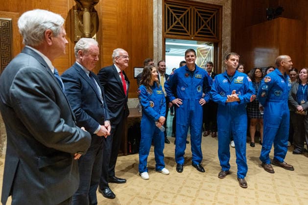 Artemis II Crew at the Capitol UNITED STATES - MAY 12: From left, Sen. John Hoeven, R-N. Dak., Sen. Chris Van Hollen, D-Md., and Sen. Jerry Moran, R-Kan., welcome the Artemis II crew to the Senate Appropriations Committee in the Dirksen Senate Offic e Building on Tuesday, May 12, 2026. The crew from left are Mission Specialist Christina Koch, Mission Specialist Jeremy Hansen, Commander Reid Wiseman and Pilot Victor Glover. (Bill Clark CQ Roll Call) Washington DC United States EDITORIAL USE ONLY Copyright: x 2026xCQxRollxCallx BillxClarkx rollcallpix170822