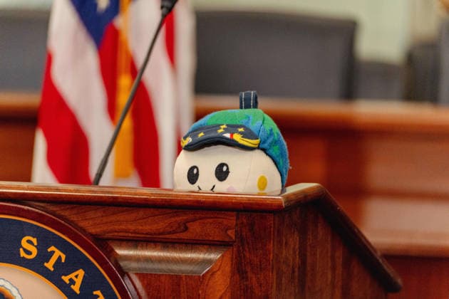 May 12, 2026, Washington, District Of Columbia, USA: Zero-g indicator and plush toy named Ã¢â‚¬oeRise,Ã¢â‚¬Â is placed by on a podium by Artemis II Commander Reid Wiseman during a meet and greet hosted by the Senate Commerce, Science, & Transportation Committee in Washington, D.C. on May 12, 2026. Washington USA - ZUMAl196 20260512_znp_l196_023 Copyright: xRaphaelxLiyx