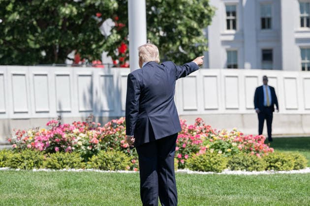 May 12, 2026, Washington, District Of Columbia, United States: U.S. President DONALD TRUMP points out the future site where he plans to build a ballroom as he departs the White House for China Washington United States - ZUMAk206 20260512_znp_k206_024 Copyright: xMattxKaminskyx