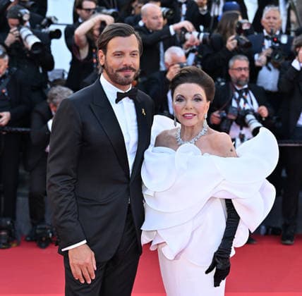 79th Cannes Film Festival: Opening Ceremony and the The Electric Kiss film screening CANNES, FRANCE - MAY 12: British actress Joan Collins (R) and French actor Laurent Lafitte (L) arrive for the Opening Ceremony and the screening of the film La Venus electrique (The Electric Kiss) at the 79th edition of the Cannes Film Festival in Cannes, France on May 12, 2026. Mustafa Yalcin Anadolu Cannes France. Editorial use only. Please get in touch for any other usage.  Copyright: x2026xAnadoluxMustafaxYalcinx