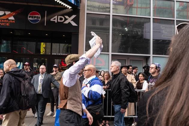 May 13, 2026, Bronx, New York, USA: New York, NY, USA, May 13, 2026: Atmosphere outside of movie theater as actors dressed as paperboys offer fake newspaper ahead of world premiere of Amazon Prime Video s Spider Noir at Regal Times Square. Bronx USA - ZUMAr339 20260513_znp_r339_004 Copyright: xLevxRadinx