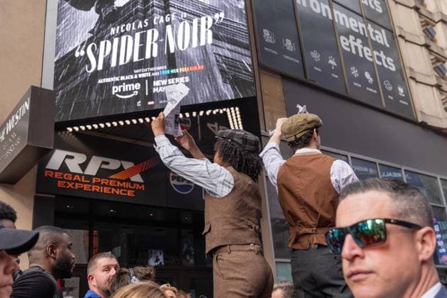 May 13, 2026, Bronx, New York, USA: New York, NY, USA, May 13, 2026: Atmosphere outside of movie theater as actors dressed as paperboys offer fake newspaper ahead of world premiere of Amazon Prime Video s Spider Noir at Regal Times Square. Bronx USA - ZUMAr339 20260513_znp_r339_008 Copyright: xLevxRadinx