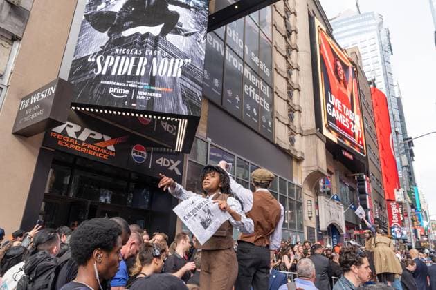 May 13, 2026, Bronx, New York, USA: New York, NY, USA, May 13, 2026: Atmosphere outside of movie theater as actors dressed as paperboys offer fake newspaper ahead of world premiere of Amazon Prime Video s Spider Noir at Regal Times Square. Bronx USA - ZUMAr339 20260513_znp_r339_010 Copyright: xLevxRadinx