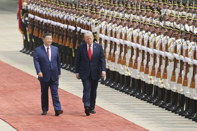 U.S. President Trump in Beijing U.S. President Donald Trump (R), alongside Chinese President Xi Jinping, receives a guard of honor during a welcoming ceremony at the Great Hall of the People in Beijing on May 14, 2026.  A14AA0005554807P