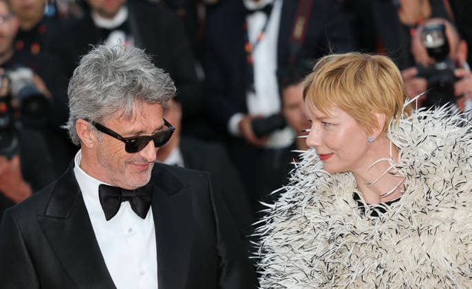 (260514) -- CANNES, May 14, 2026 -- Director Pawel Pawlikowski (L) and actress Sandra Huller arrive for the screening of the film Fatherland at the 79th edition of the Cannes Film Festival in Cannes, southern France, May 14, 2026. ) FRANCE-CANNES-FILM FESTIVAL-FATHERLAND WuxHuiwo 