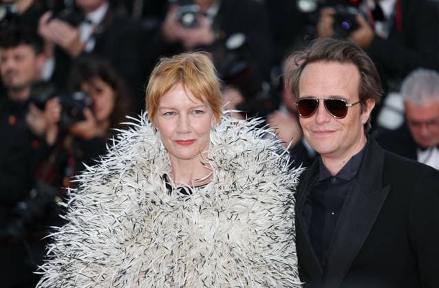 (260514) -- CANNES, May 14, 2026 -- Actor August Diehl (R) and actress Sandra Huller arrive for the screening of the film Fatherland at the 79th edition of the Cannes Film Festival in Cannes, southern France, May 14, 2026. ) FRANCE-CANNES-FILM FESTIVAL-FATHERLAND WuxHuiwo 