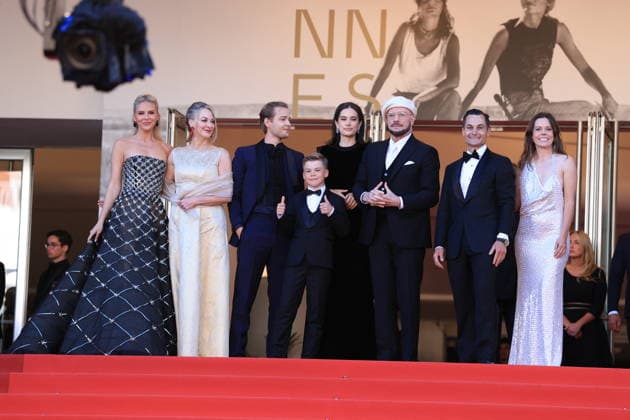 Cannes - Karma Red Carpet (L to R) Olga Hoffmann, Kelly B. Eviston, Edouard Philipponnat, Clark Shotwell, Ella Bleu Travolta, John Travolta, Jason Berger and Amy Laslett of Propeller One-Way Night Coach attend the Karma screening during the 79th annual Cannes Film Festival at Palais des Festivals on May 15, 2026 in Cannes, France. Photo by Jerome Domine ABACAPRESS.COM Cannes France  Copyright: xDominexJerome ABACAx