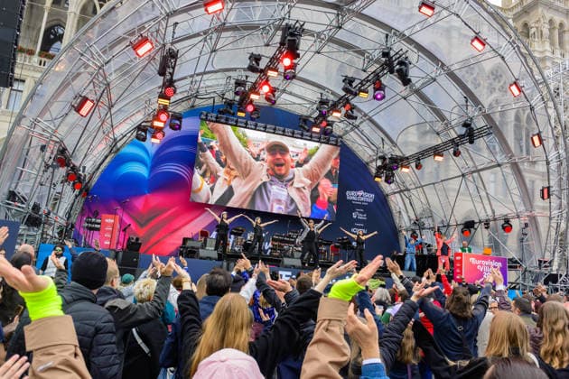 vienna, austria, 15 may 2026, esc village in front of the city hall, eurovision song contest, fans dancing to the song ymca by village people