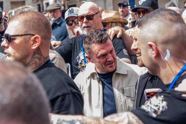 May 16, 2026, London, United Kingdom: Tommy Robinson is chaperoned by a ring of security to the start of his Unite The Kingdom Rally in Central London. Tommy Robinson supporters converged in central London, for the latest rally of patriots calling on Downing Street to put a stop to immigration. Activist Robinson™s protest was countered by a Nakba anti-racism and pro-Palestinian demonstration on the Mall. London United Kingdom  - ZUMAs197 20260516_aaa_s197_239 Copyright: xLabxMox