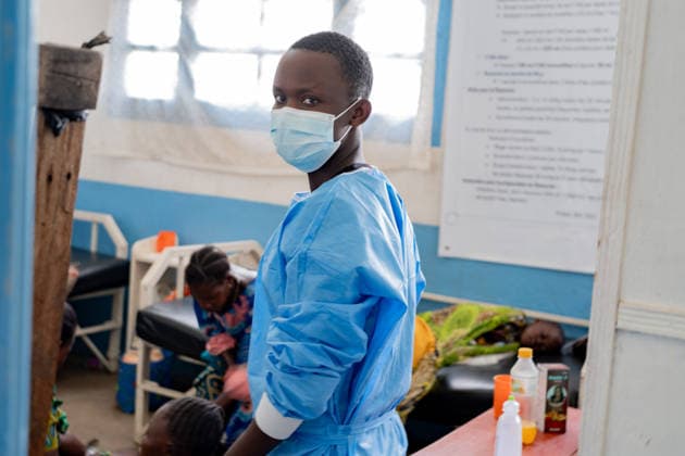 (260517) -- BEIJING, May 17, 2026 () -- A health worker wearing a mask is seen at the general reference hospital in Rwampara in eastern Democratic Republic of the Congo, on May 16, 2026. The death toll from the latest Ebola outbreak in the Democratic Republic of the Congo (DRC) has risen to 87, the Africa Centers for Disease Control and Prevention (Africa CDC) said Saturday, warning that the outbreak is driven by the Bundibugyo strain, for which no strain-specific vaccine is currently available, and that it carries a high risk of regional spread. (Str ) PHOTOS OF THE DAY Xinhua 