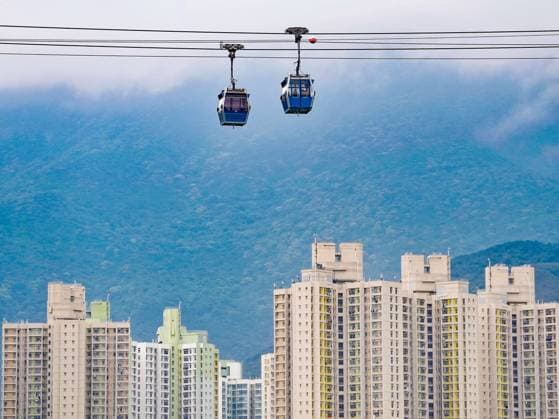 RECORD DATE NOT STATED A general view of Cable Cars of Ngong Ping 360 with the buildings of Yat Tung Estate as background. 10MAR26 SCMP Elson Li Hong Kong China EDITORIAL USE ONLY  Copyright: xx 202603106f45d637 ElsonxLix scmpphotostwo027672