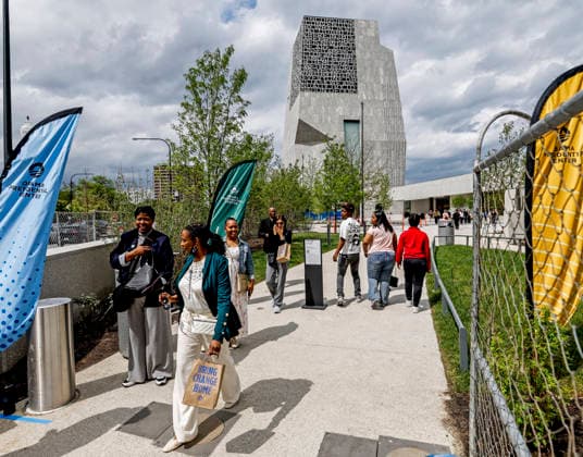 People walk by the Obama Presidential Center in Chicago, Illinois, on Tuesday, May 19, 2026. The grand opening of the center will take place on June 18 and the public opening will be June 19th.  CHI20260519815 TANNENxMAURY