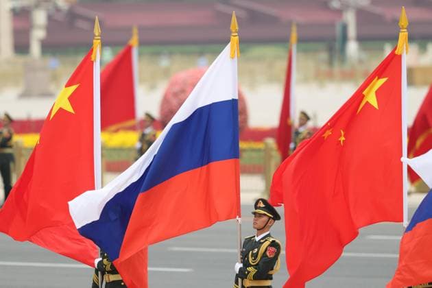 China-Russia summit People s Liberation Army honor guards hold Chinese and Russian flags ahead of a welcoming ceremony for Russian President Vladimir Putin at the Great Hall of the People in Beijing on May 20, 2026, to be followed by a summit between him and Chinese President Xi Jinping. (Pool photo)  A14AA0005587099P