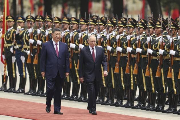 China-Russia summit Russian President Vladimir Putin (R) attends a welcoming ceremony with Chinese President Xi Jinping at the Great Hall of the People in Beijing ahead of their summit meeting on May 20, 2026. (Pool photo)  A14AA0005587101P
