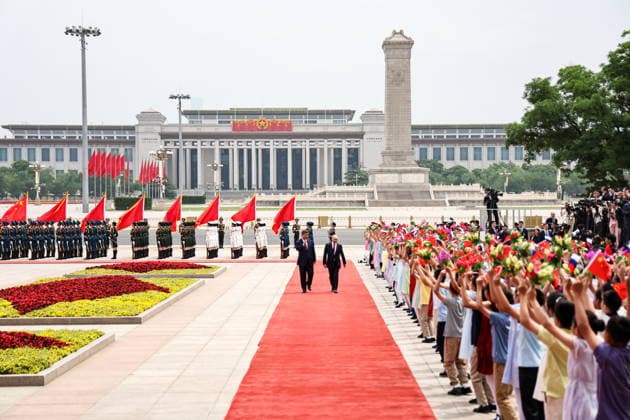 CHINA, BEIJING - MAY 20, 2026: Xi Jinping, President of China, and his counterpart Vladimir Putin (L-R front) of Russia enjoy a welcoming ceremony in Tiananmen Square. Putin s official visit marks 25 years since the 2001 Treaty of Good Neighbourliness and Friendly Cooperation between Russia and China. Alexander Kazakov Russian Presidential Press and Information Office TASS  92770968