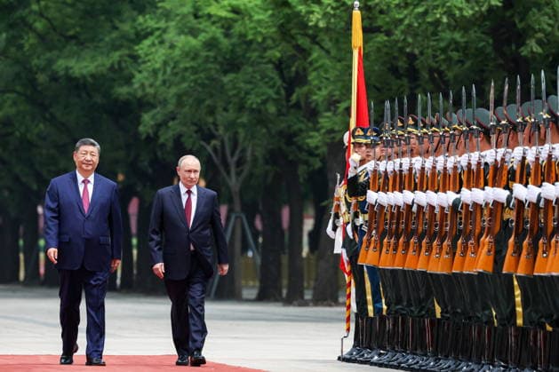 CHINA, BEIJING - MAY 20, 2026: Xi Jinping, President of China, and his counterpart Vladimir Putin (L-R) of Russia walk past honour guards during a welcoming ceremony in Tiananmen Square. Putin s official visit marks 25 years since the 2001 Treaty of Good Neighbourliness and Friendly Cooperation between Russia and China. Alexander Kazakov Russian Presidential Press and Information Office TASS  92770998