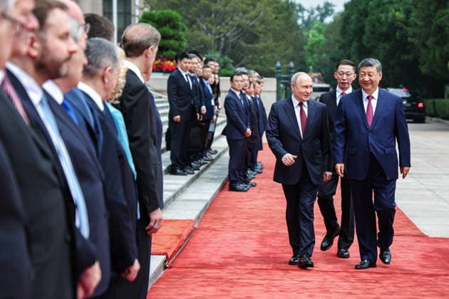 CHINA, BEIJING - MAY 20, 2026: Xi Jinping, President of China, and his counterpart Vladimir Putin (R-L front) of Russia emerge during a welcoming ceremony in Tiananmen Square. Putin s official visit marks 25 years since the 2001 Treaty of Good Neighbourliness and Friendly Cooperation between Russia and China. Alexander Kazakov Russian Presidential Press and Information Office TASS  92771053