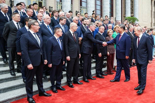 CHINA, BEIJING - MAY 20, 2026: Vladimir Putin, President of Russia, his counterpart Xi Jinping (R-L front) of China, Russia s Science and Higher Education Minister Valery Falkov, Construction, Housing and Utilities Minister Irek Faizullin, Finance Minister Anton Siluanov, Economic Development Minister Maxim Reshetnikov, Transoport Minister Andrei Nikitin, Culture Minister Olga Lyubimova and Agriculture Minister Oksana Lut (L-R front) shake hands during a welcoming ceremony in Tiananmen Square. Putin s official visit marks 25 years since the 2001 Treaty of Good Neighbourliness and Friendly Cooperation between Russia and China. Alexander Kazakov Russian Presidential Press and Information Office TASS  92771109