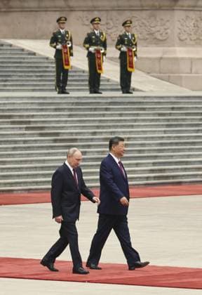 China-Russia summit Russian President Vladimir Putin (front, L) attends a welcoming ceremony with Chinese President Xi Jinping (front, R) at the Great Hall of the People in Beijing ahead of their summit meeting on May 20, 2026. (Pool photo)  A14AA0005587386P