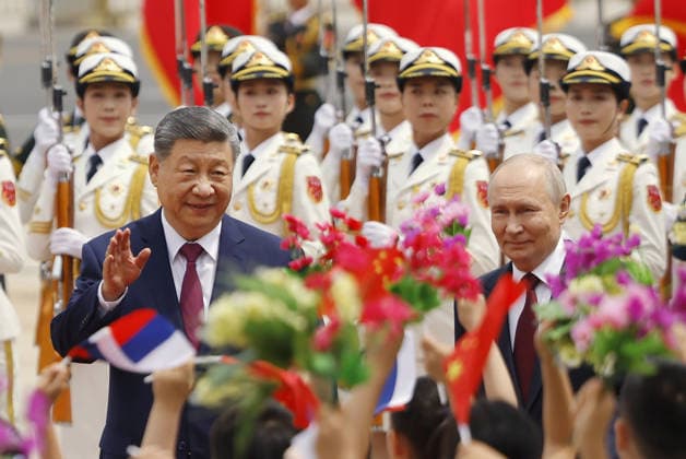 China-Russia summit Russian President Vladimir Putin (R) attends a welcoming ceremony with Chinese President Xi Jinping at the Great Hall of the People in Beijing ahead of their summit meeting on May 20, 2026. (Pool photo)  A14AA0005587388P