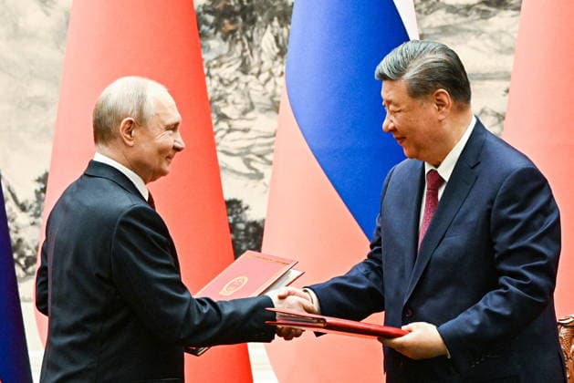 CHINA, BEIJING - MAY 20, 2026: Vladimir Putin (L), President of Russia, and his counterpart Xi Jinping of China sign joint documents following bilateral talks at the Great Hall of the People. Putin s official visit marks 25 years since the 2001 Treaty of Good Neighbourliness and Friendly Cooperation between Russia and China. Kristina Solovyova POOL TASS  92773587