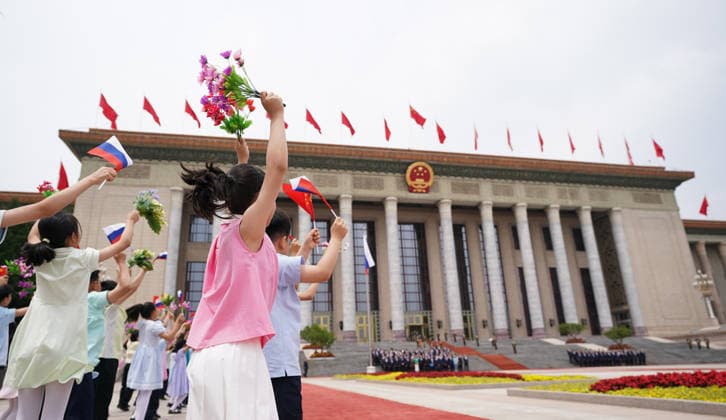 BEIJING, CHINA - MAY 20: Children wave flags to welcome Russian President Vladimir Putin on May 20, 2026 in Beijing, China. Chinese President Xi Jinping held a welcome ceremony on the morning of May 20 outside the Great Hall of the People in central Beijing for Russian President Vladimir Putin, who is on a state visit to China.  Copyright: xVCGx 111642856336