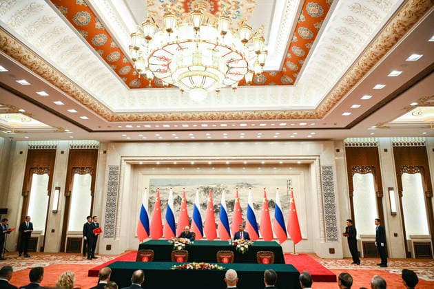CHINA, BEIJING - MAY 20, 2026: Vladimir Putin, President of Russia, and his counterpart Xi Jinping (L-R centre) of China sign joint documents following bilateral talks at the Great Hall of the People. Putin s official visit marks 25 years since the 2001 Treaty of Good Neighbourliness and Friendly Cooperation between Russia and China. Kristina Solovyova POOL TASS  92773655