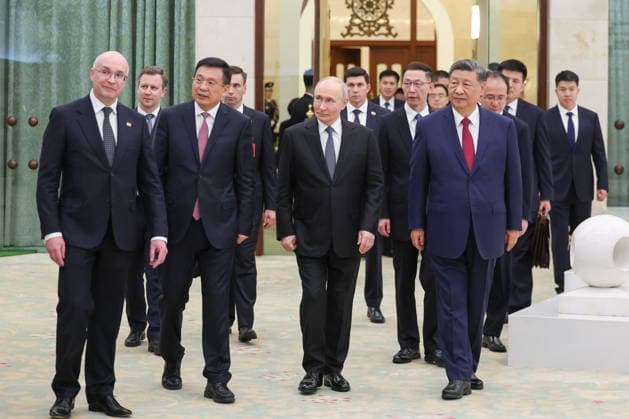 CHINA, BEIJING - MAY 20, 2026: Xi Jinping, President of China, his counterpart Vladimir Putin of Russia, accompanied by Fu Hua, President of the Xinhua News Agency, and Andrei Kondrashov (R-L front), TASS Director General, view a photography exhibition titled Unwavering Friendship of the Great Nations, Strategic Partnership of the Great Powers and held jointly by the TASS and Xinhua news agencies. Putin s official visit marks 25 years since the 2001 Treaty of Good Neighbourliness and Friendly Cooperation between Russia and China. Alexander Kazakov Russian Presidential Press and Information Office TASS  92782449