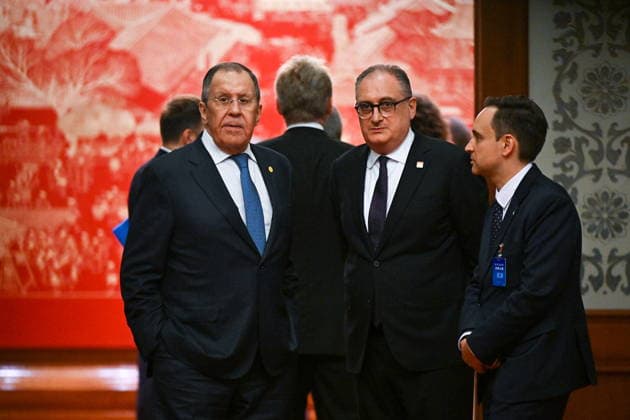 CHINA, BEIJING - MAY 20, 2026: Sergei Lavrov, Foreign Minister of Russia, and Ambassador Igor Morgulov (L-R) attend an informal tea meeting at the Great Hall of the People. Vladimir Putin, President of Russia, makes an official visit to mark 25 years since the 2001 Treaty of Good Neighbourliness and Friendly Cooperation between Russia and China. Kristina Solovyova POOL TASS  92783894